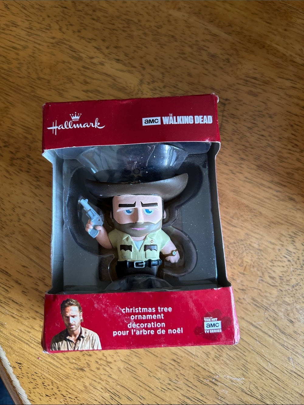Hallmark ornament in red, tan, brown, green and black